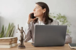 A Female Paralegal Talking To A Client Over The Phone