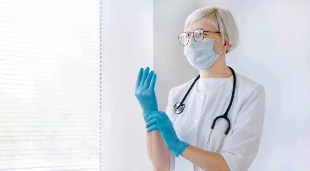 Doctor Wearing Gloves Face Mask E1657525330655