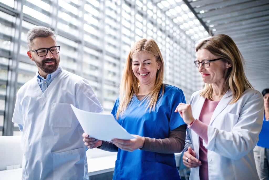 Group Of Doctors Walking In Corridor Holding Medical Resume 1024X683 1