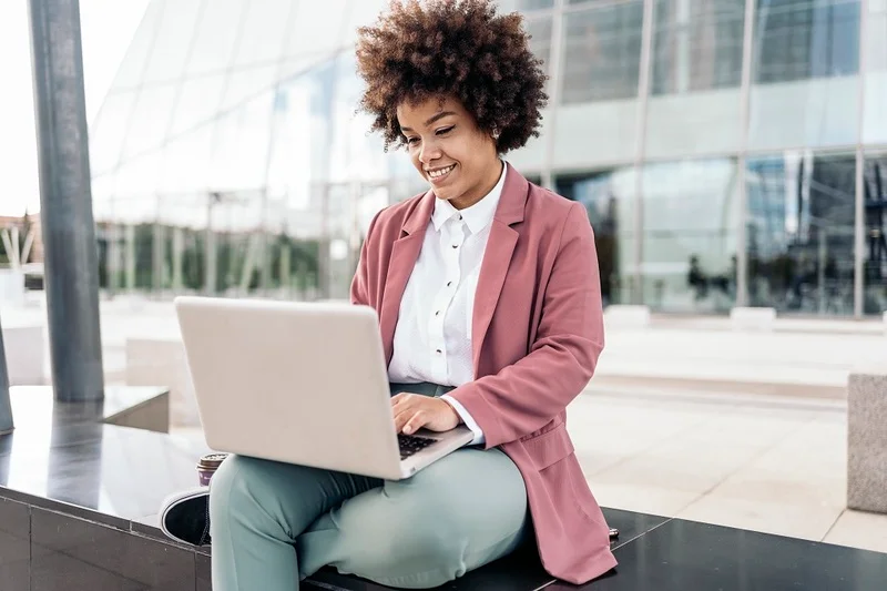 A Job Applicant Composing A Thank You Email After A Job Interview Using Her Laptop