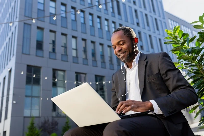 A Job Candidate Researching How To Apply For Federal Jobs On His Laptop