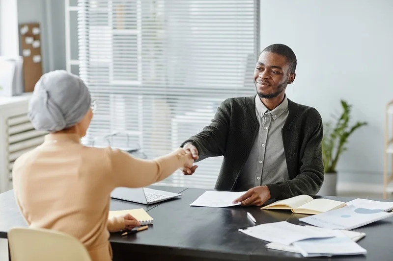 Candidate Shaking Hands With Recruiter In Job Interview