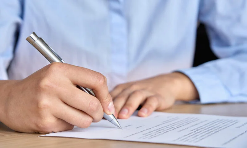 Close Up View Of Businesswoman Hand Signing Paper 2048X1229 1