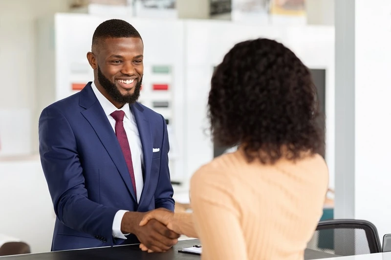 Customer Service Manager Shaking Hands Client