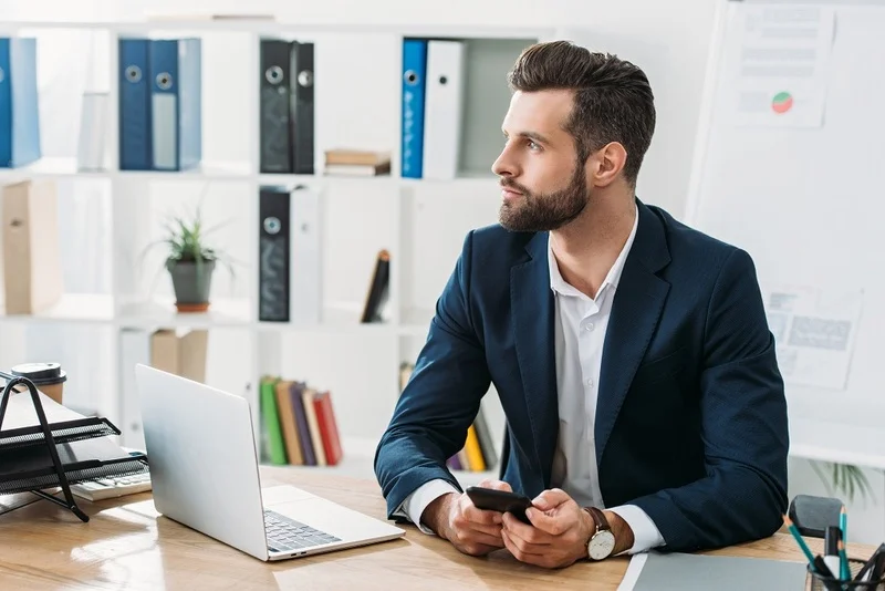 Handsome Advisor In Suit Holding Smartphone 1