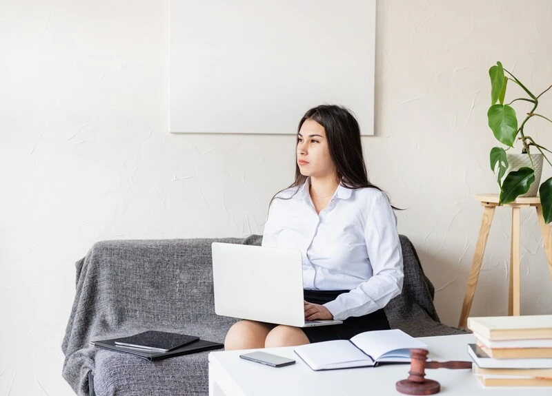 Lady School Counselor Holding Laptop