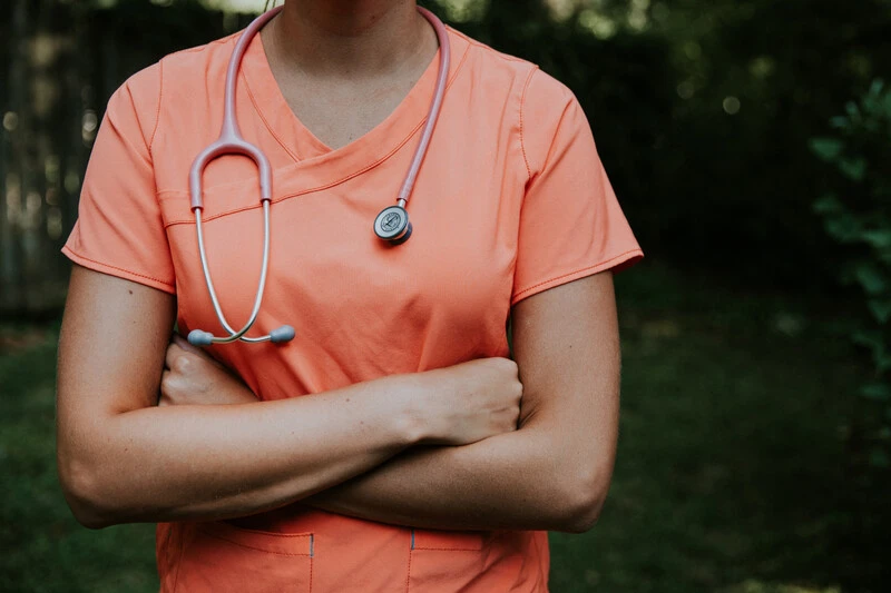 Medical Assistant In Orange Suit