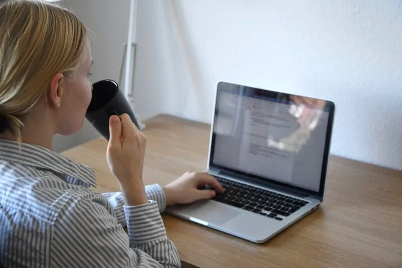 Millennial Job Seeker Typing Her Resume On Her Laptop E1650955499317