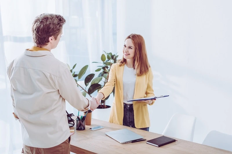 Recruiter Shaking Hands Applicant