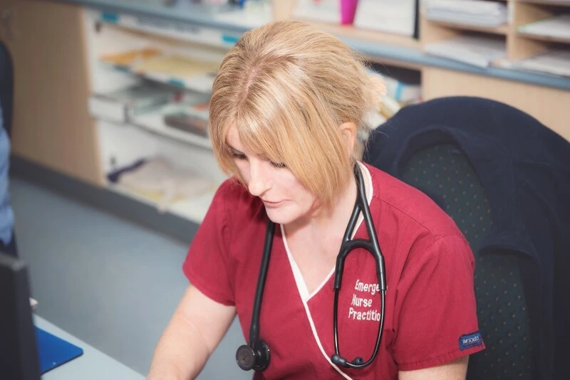 Travel Nurse Reviewing Patient Data