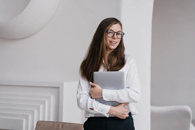 Woman Professional Holding Laptop E1658383137451