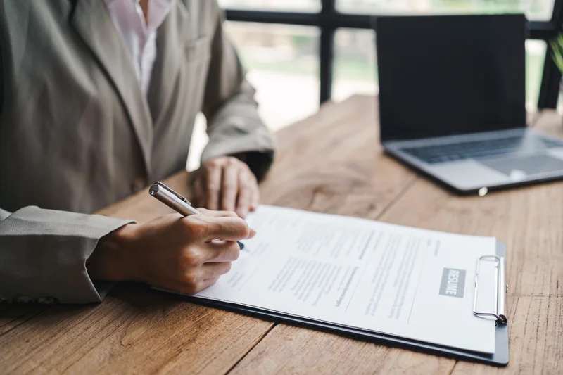 Woman Submitting Resume To Interview For A Job Wit 2023 01 31 00 19 51 Utc