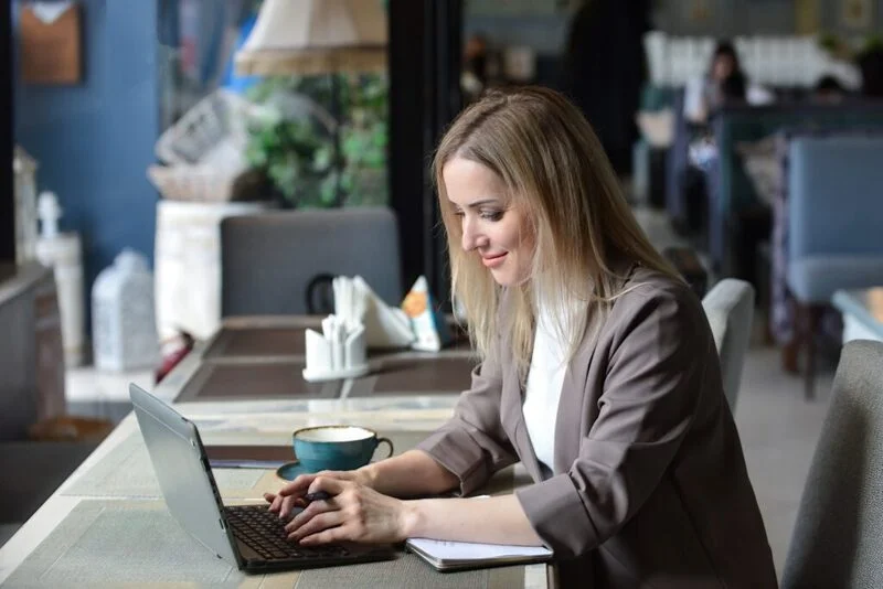 Women On Coffee Shop Writing Resume In Laptop 1024X683 1