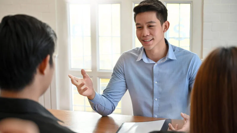 Young Man Talking With Interview Job Scaled 1