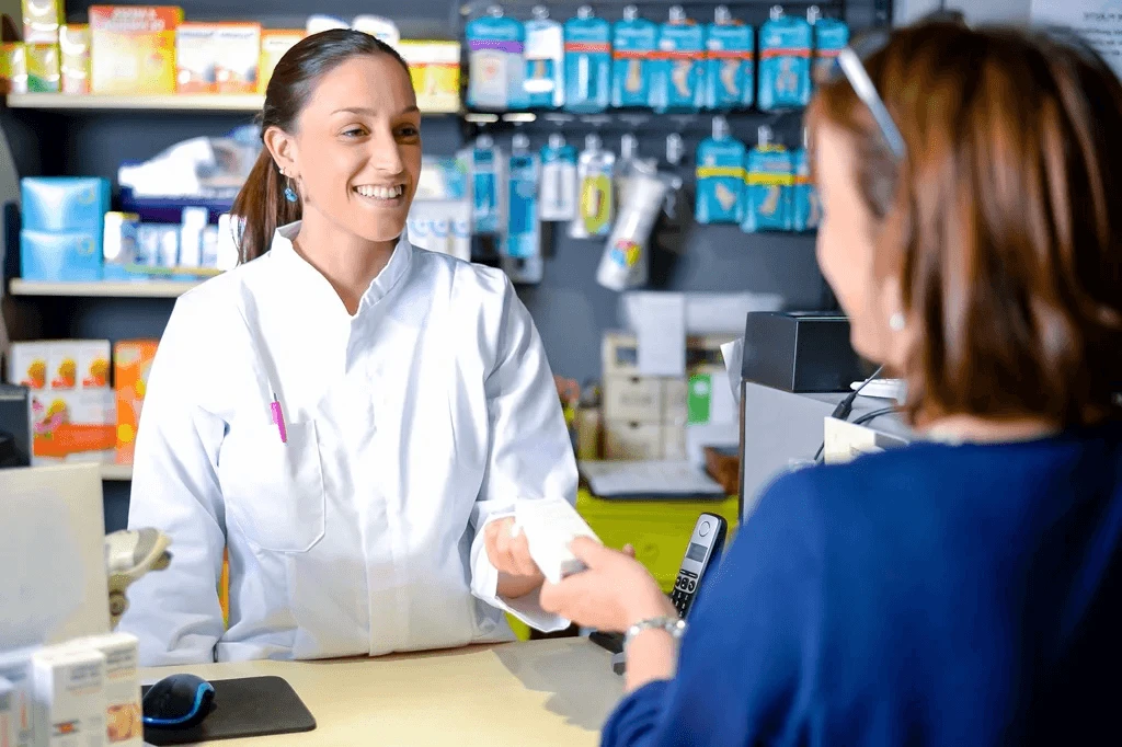 Pharmacist Assisting A Customer