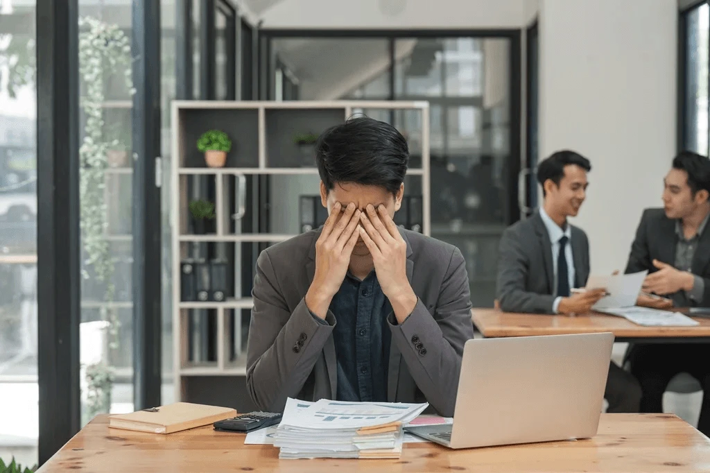 Employee Being Stressed At Work Due To A Heavy Workload