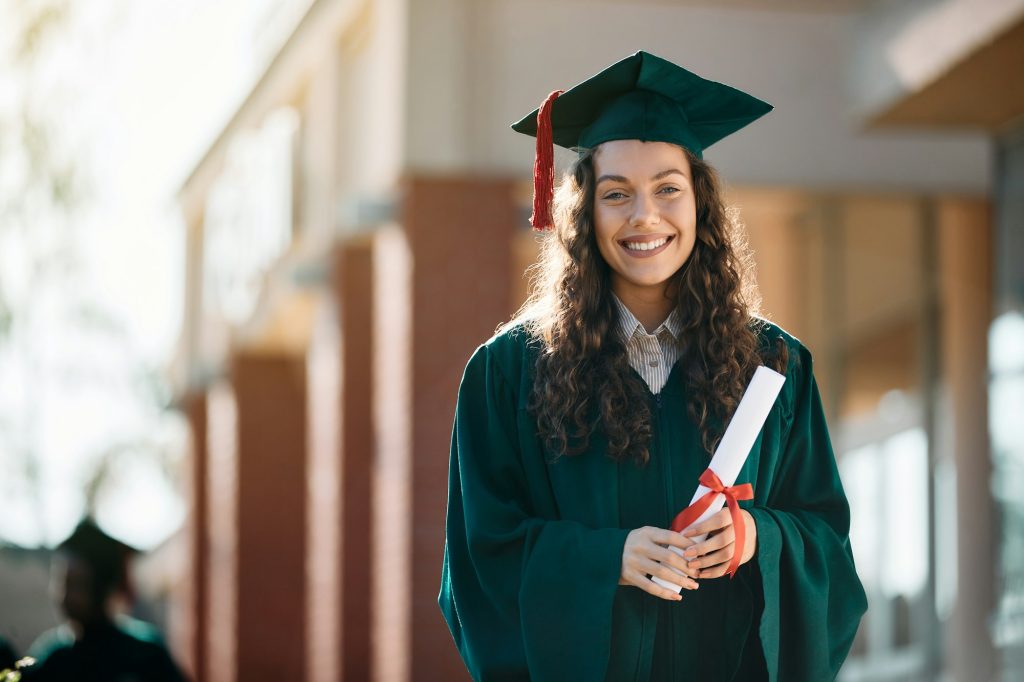 Happy Female Graduate Student With Diploma Looking.