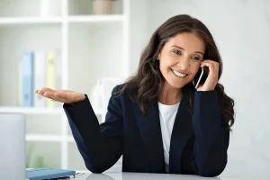 a cheerful woman answering the phone interview questions positively