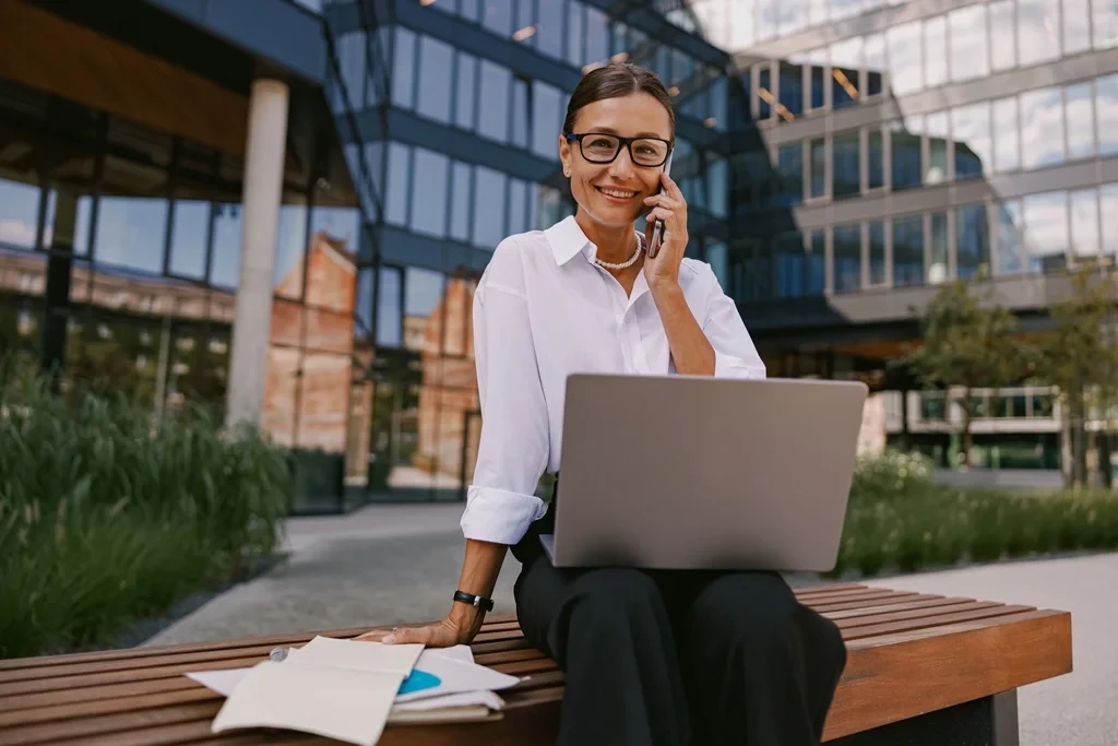 A Professional Woman Just Finished Reviewing Phone Interview Questions Before The Actual