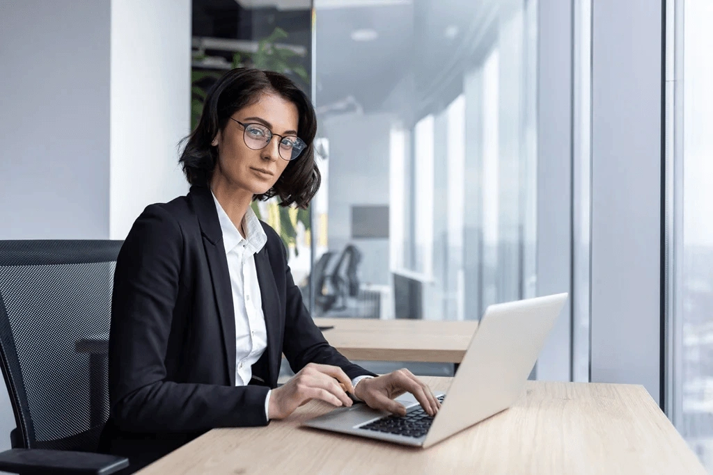 Confident Career Woman Writing Down Her Skills On Her Job Application Letter