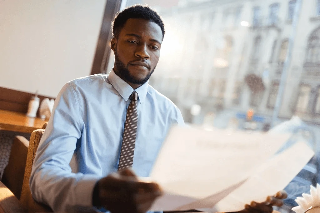 Job Seeker Scanning His Resume After Knowing The Highest Paying Jobs Without A Degree