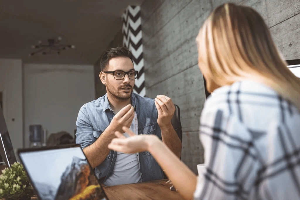 Two Persons Discussing How To Develop Communication Skills