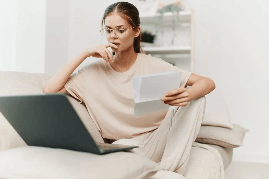 Woman Polishing Her Job Application Letter In The Couch