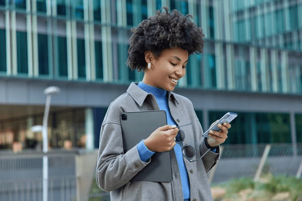 Woman Studying Apps On Her Phone And Tablet For Skill Building