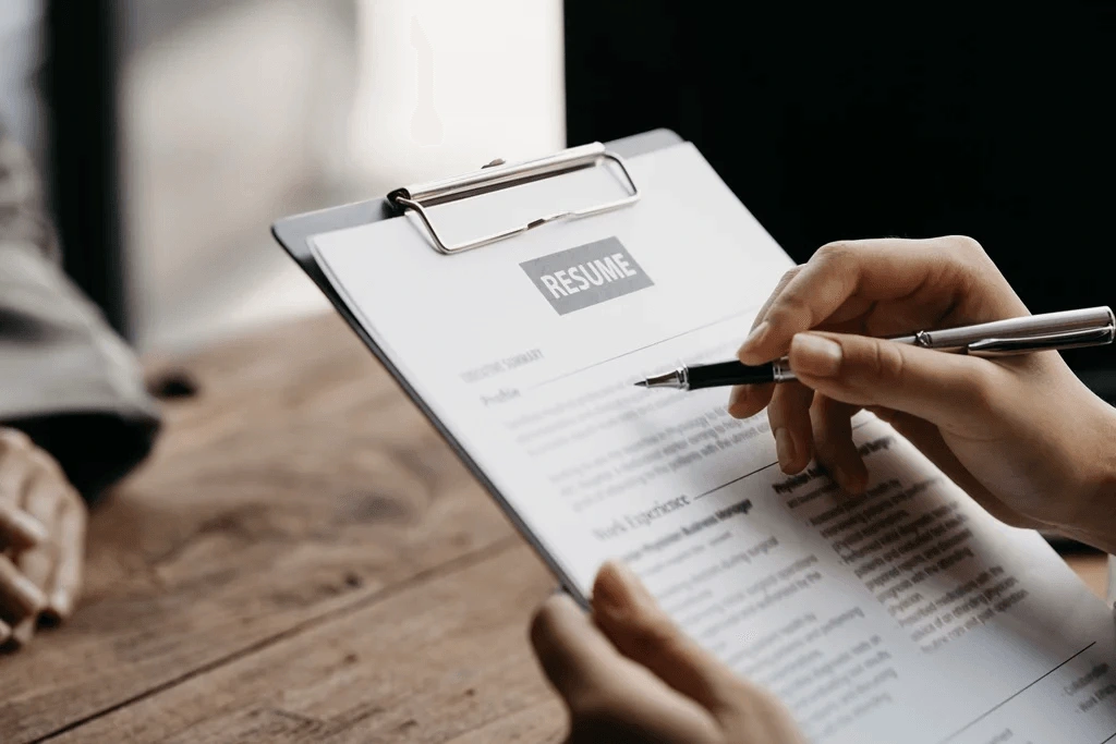 Applicant Reviewing The Final Output Of Her Resume From Resume Builder