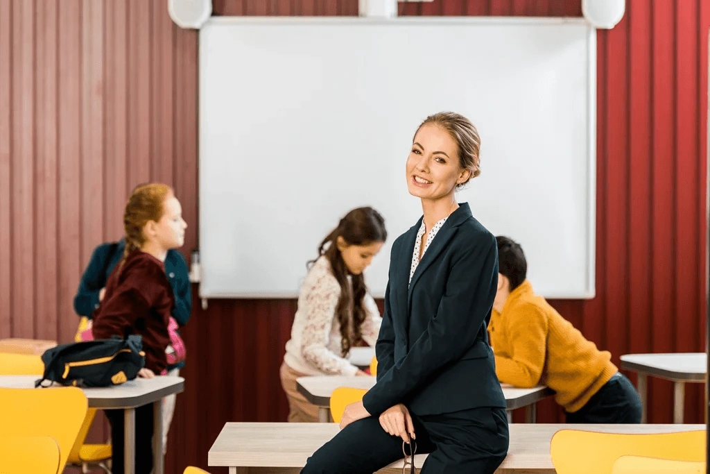 Cheerful Female Substitute Teacher During A Class