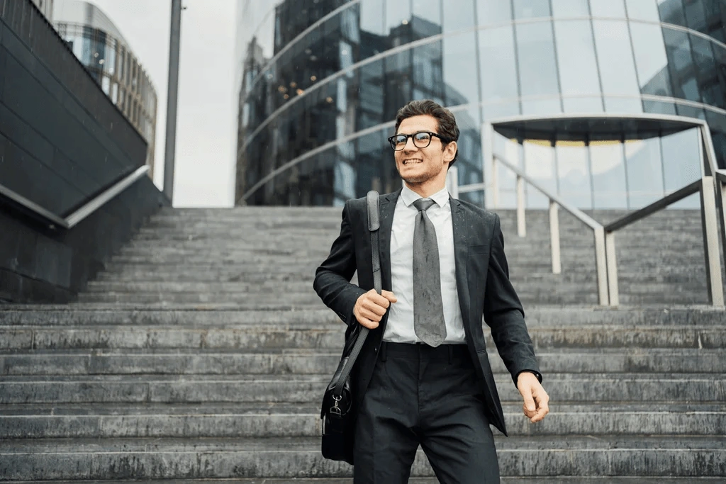 Confident Career Professional Walking Down The Stairs