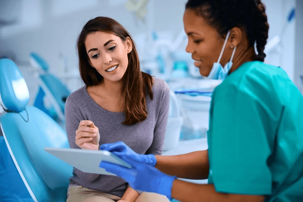 Dental Assistant Accommodating A Patient