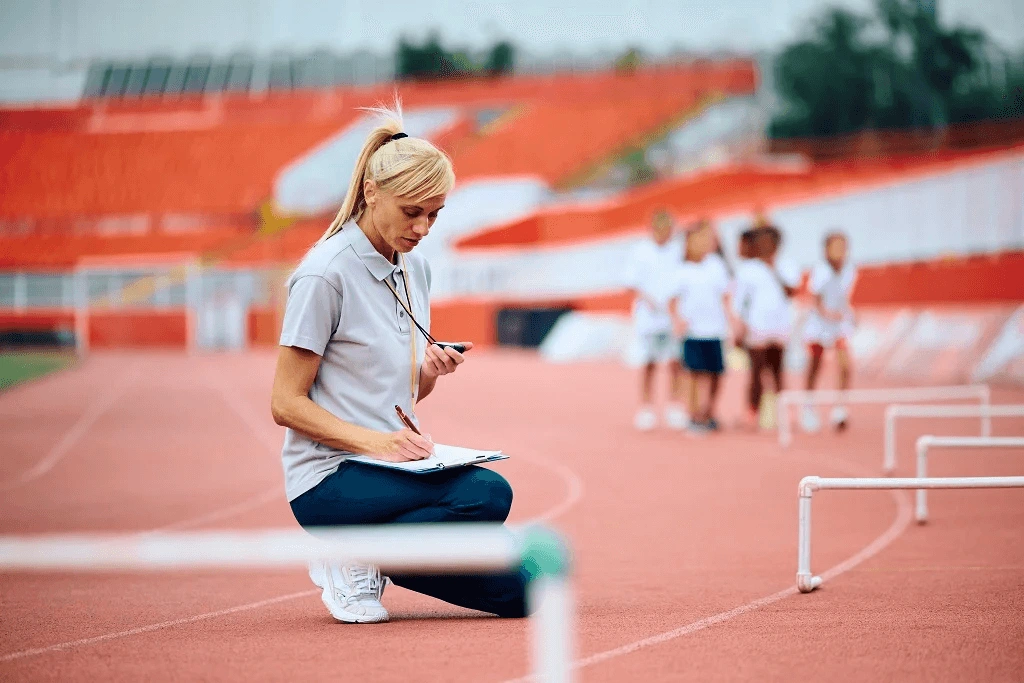 Female Pe Instructor Tracking Her Students Skills Development