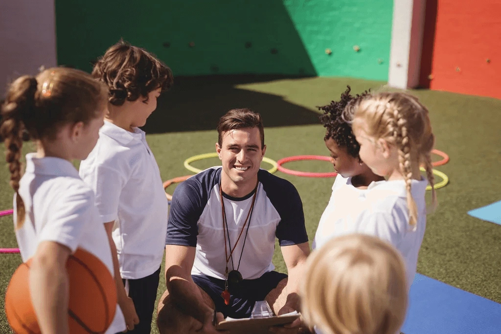 Pe Instructor Discusses Skills In Physical Education To Her Young Students