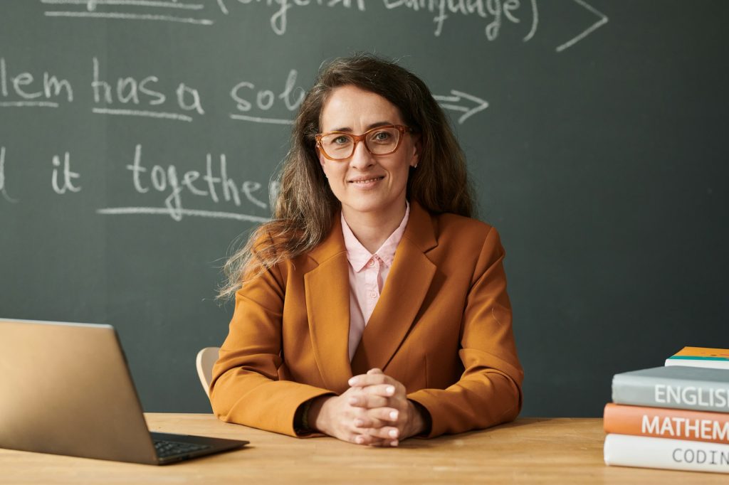 Portrait Of Female Teacher At Workplace