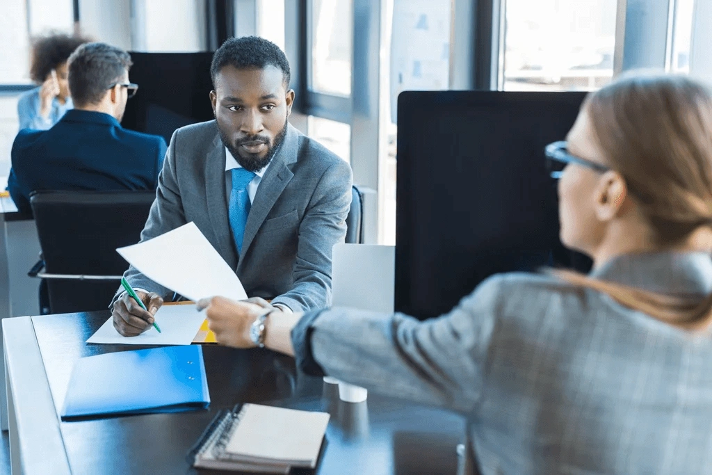 Recruiter Reaching A Job Offer Letter To The Top Applicant