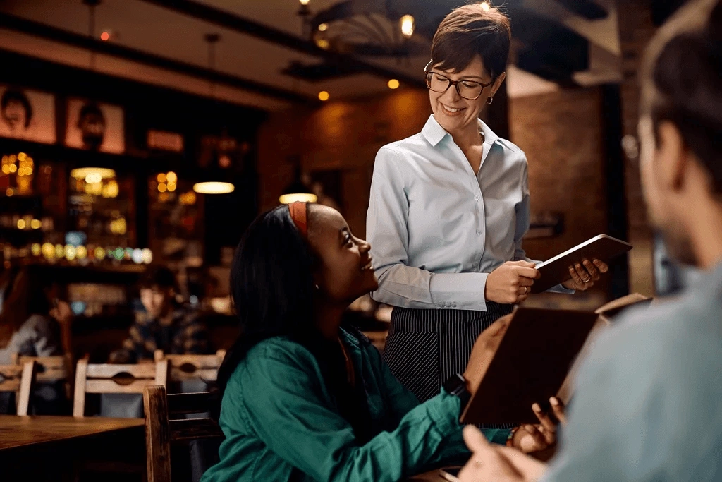 Server Happily Gets The Order Of Customers With A Device