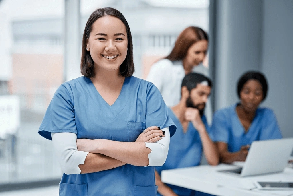 Team Of Nurses Helping Each Other In A Meeting