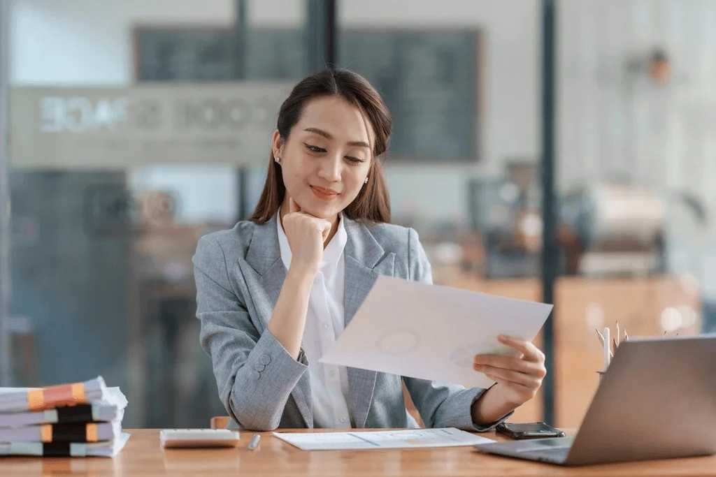 Top Applicant Reading A Job Offer Letter Happily