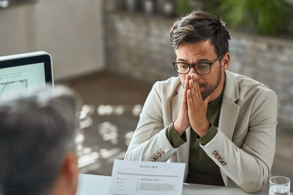 Worried Male Candidate Having A Job Interview In The Office