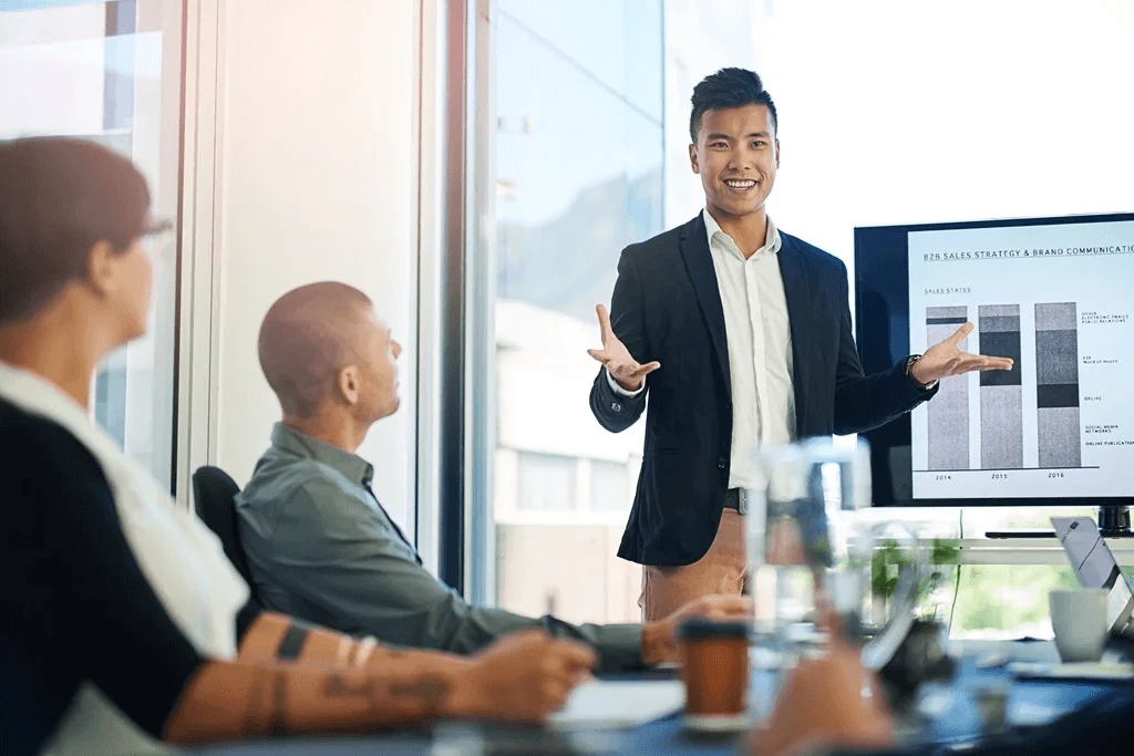 Confident Employee Presenting In Front Of The Upper Management