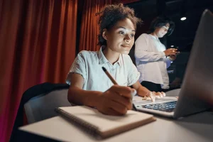 Creative Writer Drafting A Blog Using Her Laptop