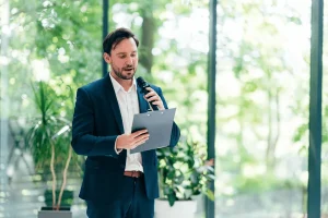 Male Professional Presenting An Impressive Speech In An Event