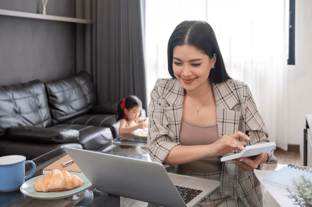 Mom Working On An Accounting Role At Home