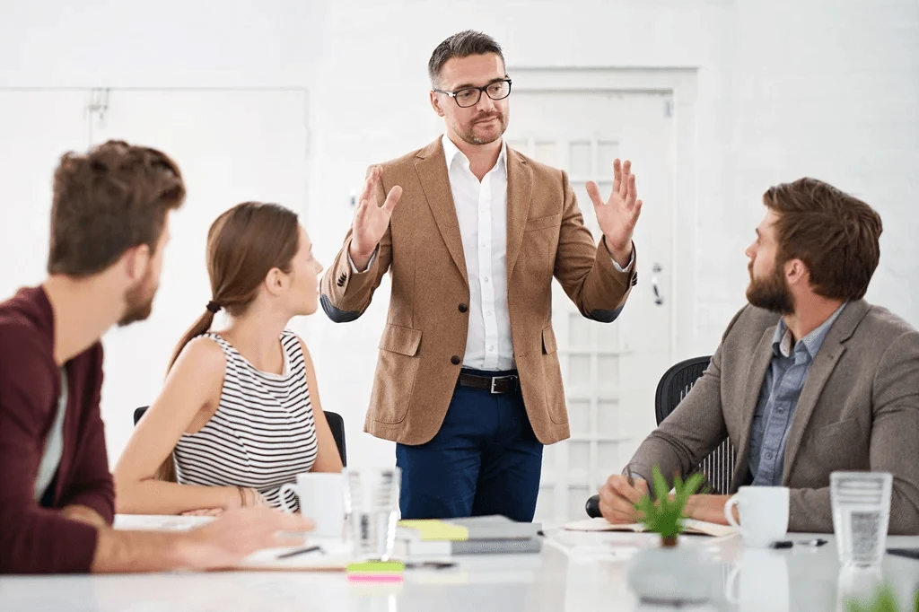 Project Manager Discussing His Plans During A Meeting