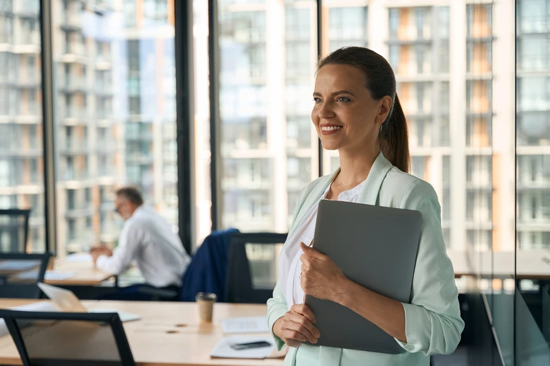 Ambitious Lady At Office Smiling And Anticipating