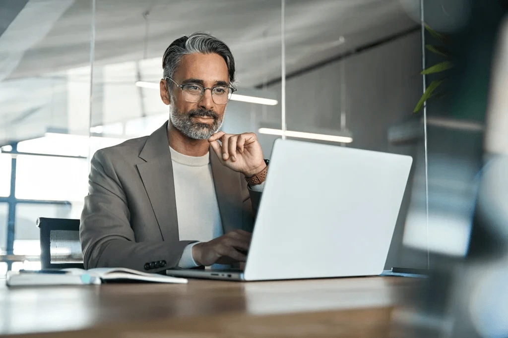 Career Development Coach Using A Laptop