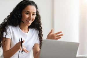 Excited Young Woman Having Video Interview From Home