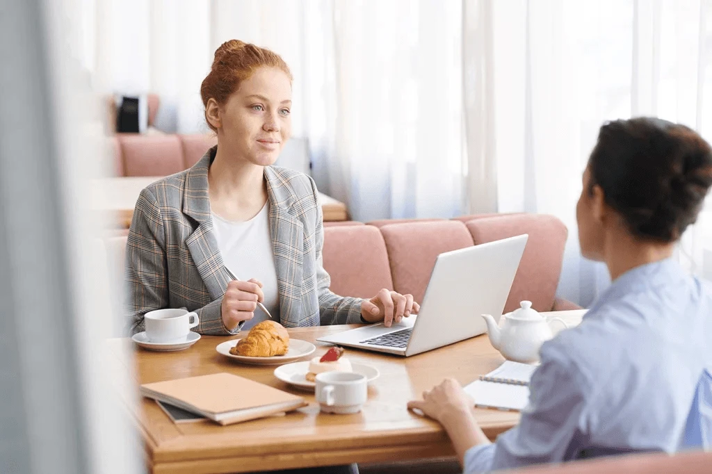 Meet And Greet Interview Taking Place In A Coffee Shop