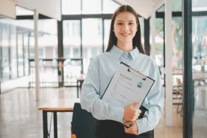 college student holding her resume